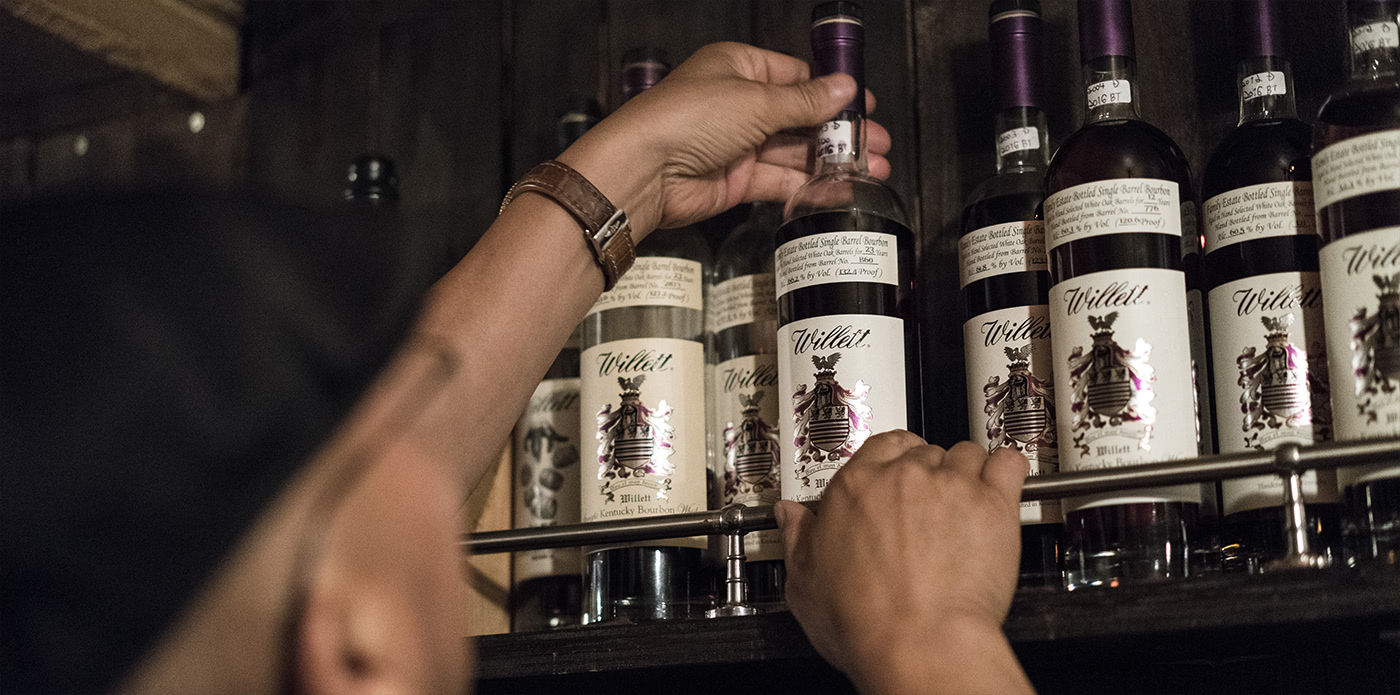 Mr. Ishida inspects his massive lineup of Willett whiskies.