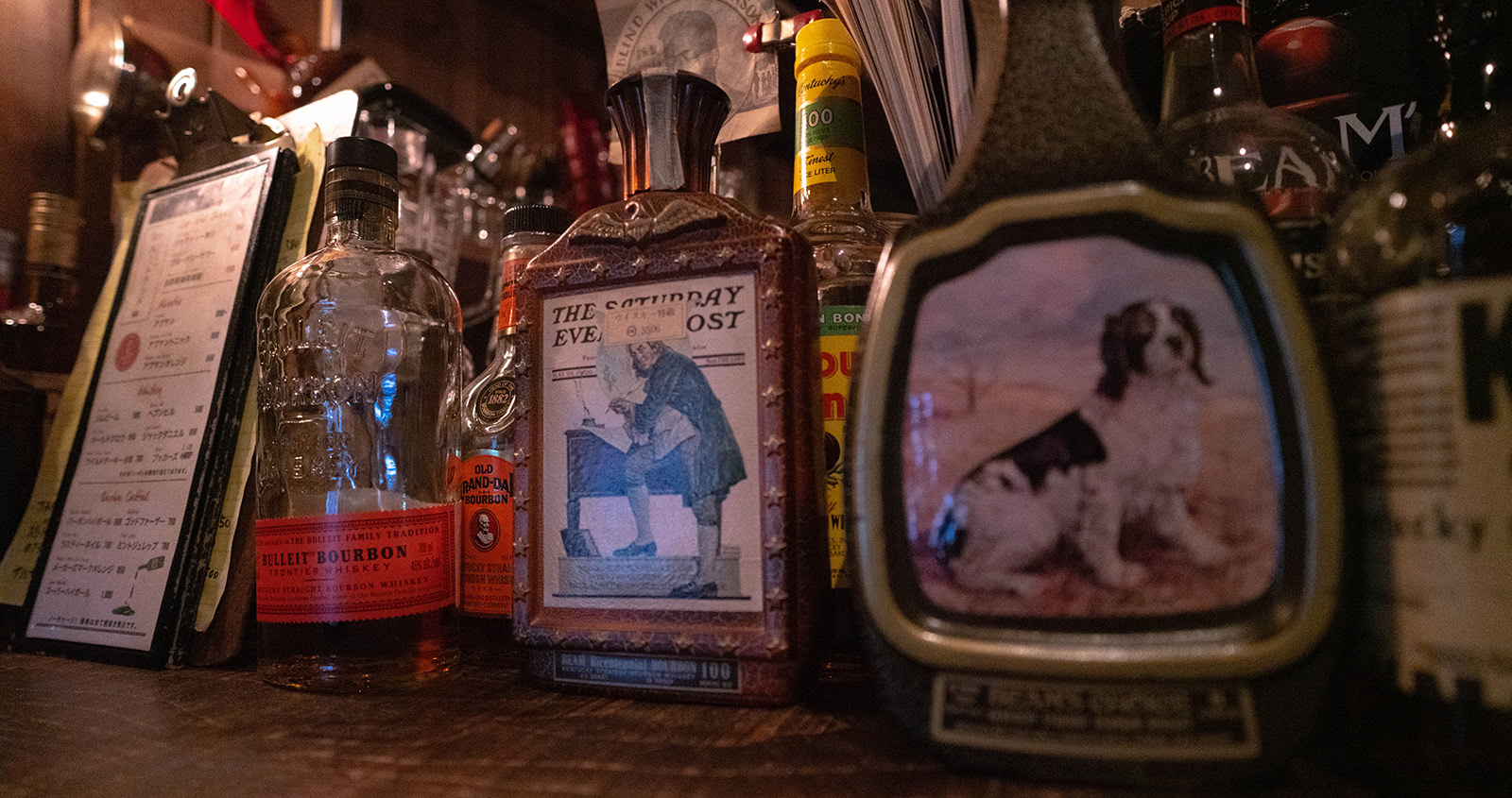 New and old bourbon bottles line the bar