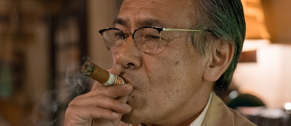 Mr. Tatsumi, often found with a cigar in hand, but not always so serious